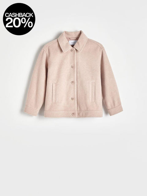 Beige jacket on a light beige background