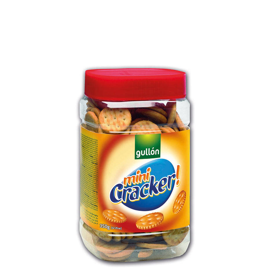 A clear plastic jar containing Gullon Mini Cracker biscuits with a red lid on top. The label on the jar is predominantly yellow and orange with text and graphics depicting the product.