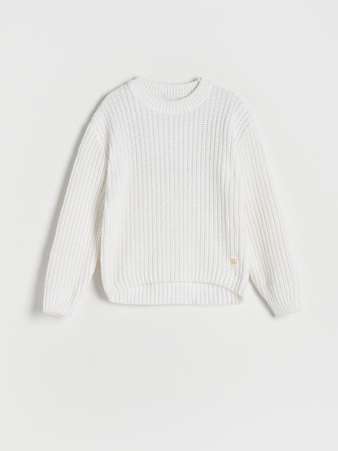 White ribbed sweater on a light gray background