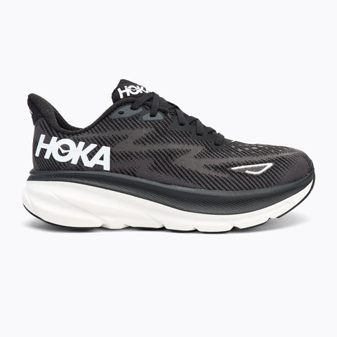 Black running shoe with white sole on a white background