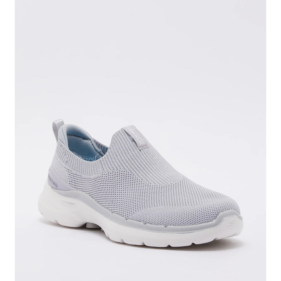 A light gray slip-on sneaker with a textured knit upper, white sole, and light blue lining, shown from a three-quarters angle on a white background.
