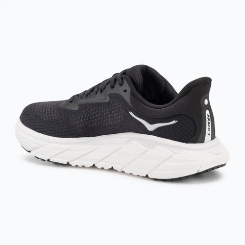 Black running shoe with white sole on a white background