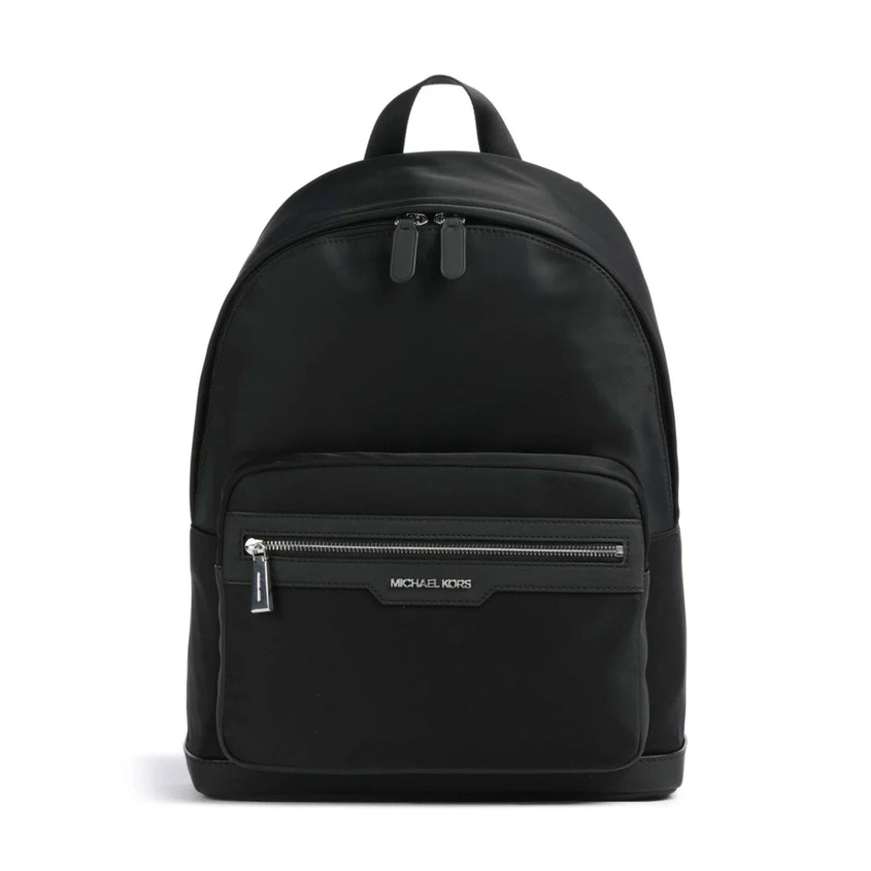 A black Michael Kors backpack with a front zippered pocket and top handle, shown against a plain white background.