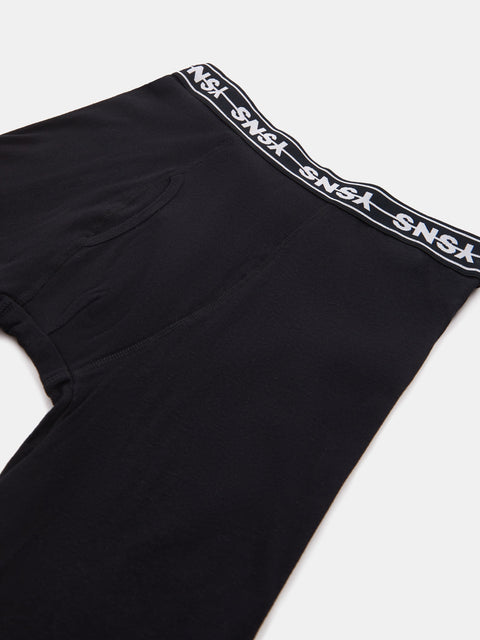 Black shorts with a white logo tape on a light gray background