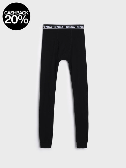 Black leggings with a logo on the waistband against a white background