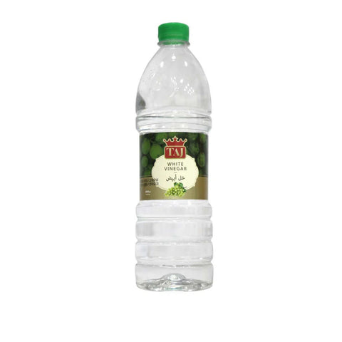 Clear bottle of Taj white vinegar with a green cap on a white background