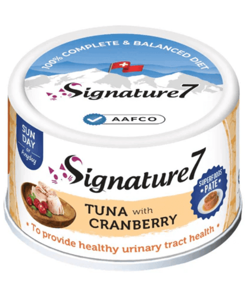 Can of Signature 7 tuna with cranberry pet food on a white background