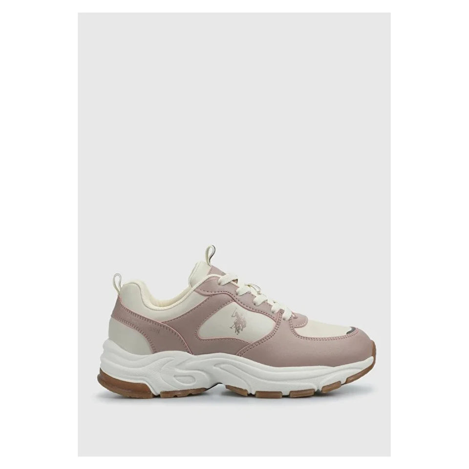 A single low-top sneaker in dusty pink and cream, featuring a chunky white midsole and a small embroidered polo player logo on the side, set against a light gray background.