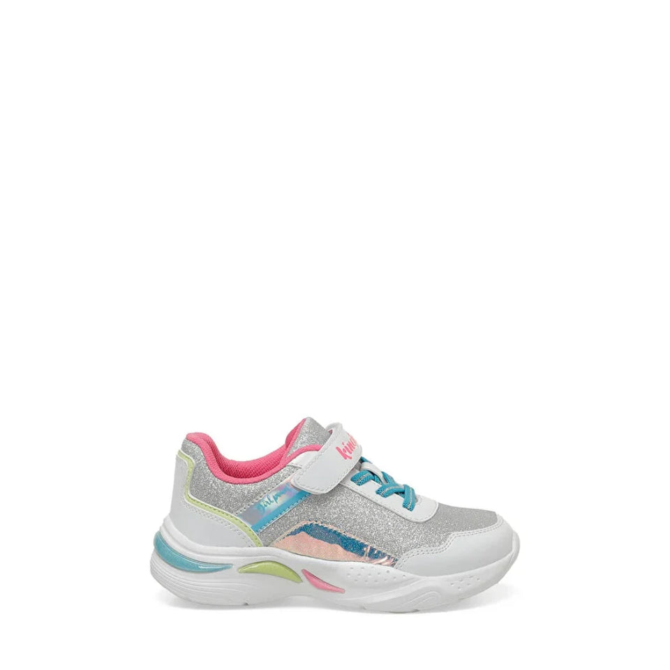A toddler's athletic sneaker in white and silver glitter, featuring a pink collar lining, turquoise and pink laces, and a white hook-and-loop strap across the top. The shoe is shown from a side profile view against a plain white background.
