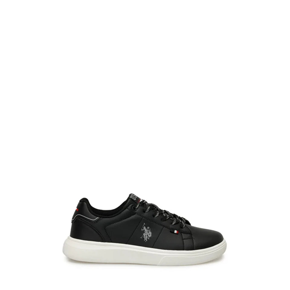 A black leather low-top sneaker with a thick white sole, featuring the U.S.