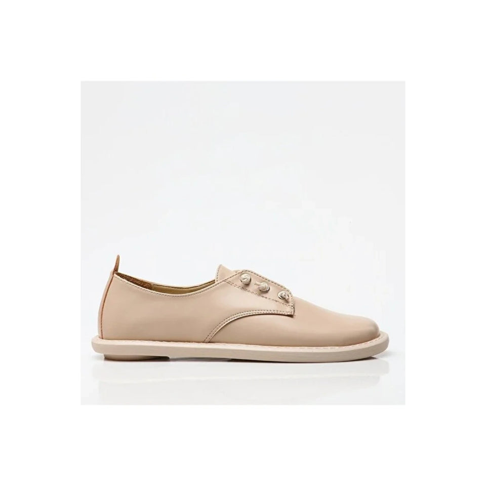 A single light beige leather lace-up shoe with decorative metal eyelets, shown in a side profile on a white background.