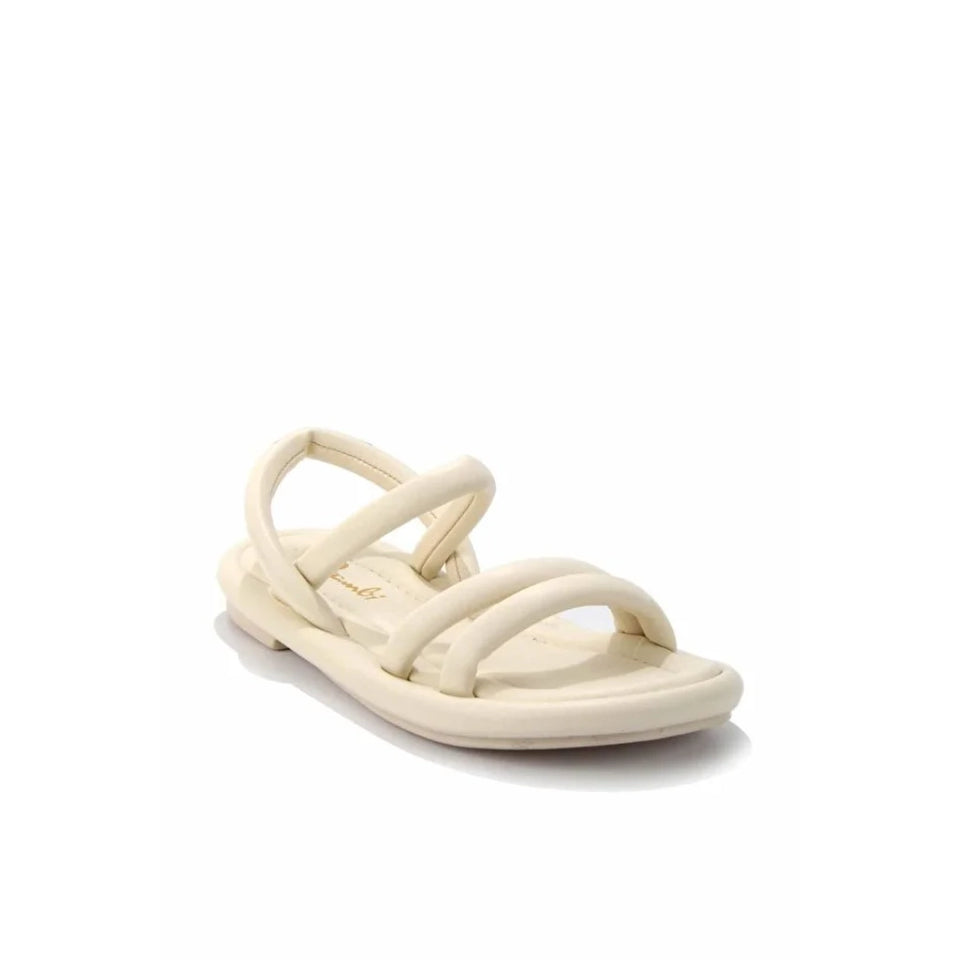 A single cream-colored minimalist flat sandal with multiple thick straps, shown from a side profile on a white background.