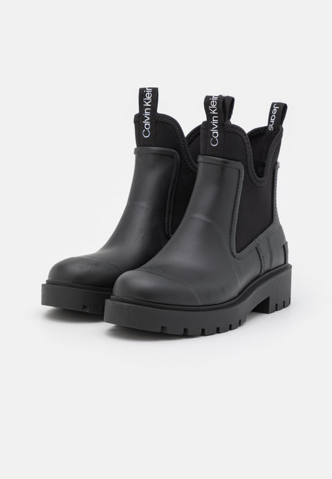 Black rain boots with Calvin Klein branding on a white background