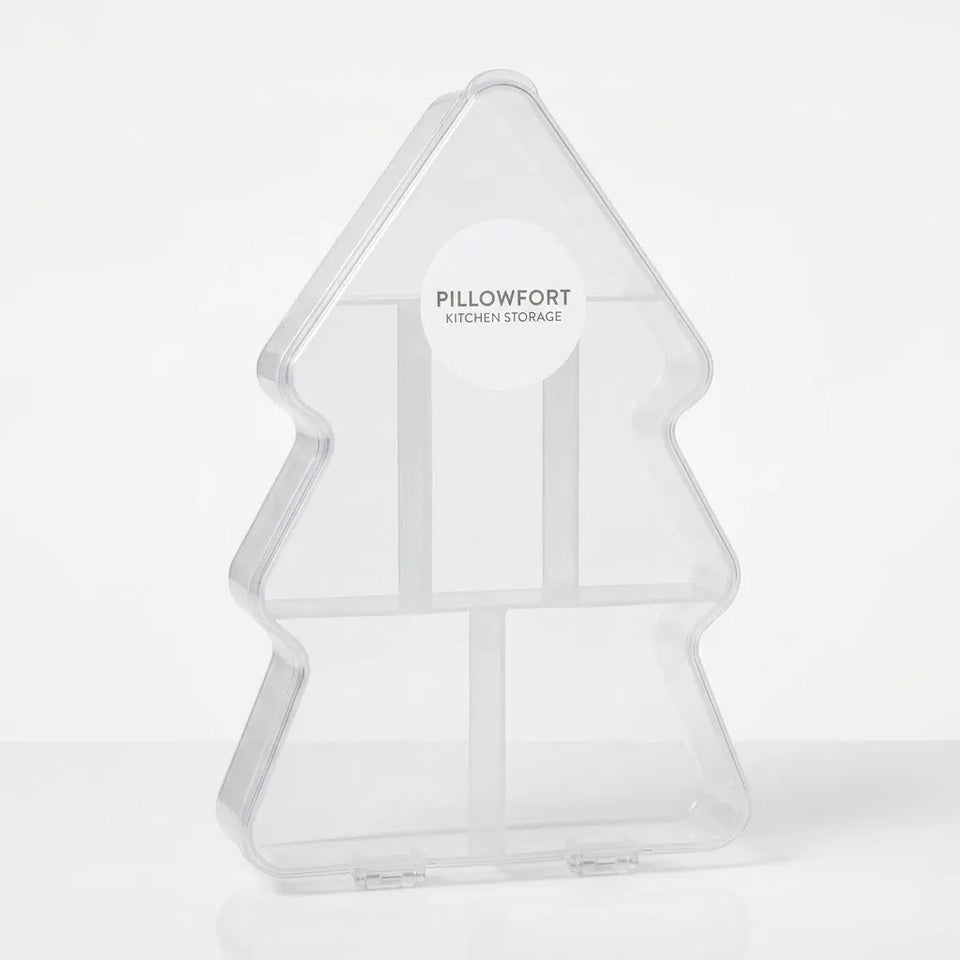 A clear acrylic kitchen storage organizer shaped like a Christmas tree, featuring three vertical compartments and a white circular sticker on the front with the brand name 'PILLOWFORT KITCHEN STORAGE'.