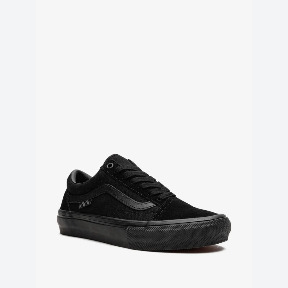A black low-top Vans platform sneaker with a thick black sole, black laces, and a black side stripe, shown from a three-quarters angle on a light gray background.