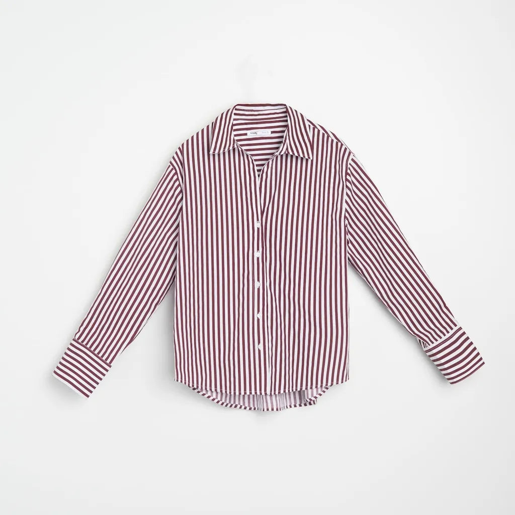 A long-sleeve button-up shirt with vertical red and white stripes, laid flat against a clean white background.