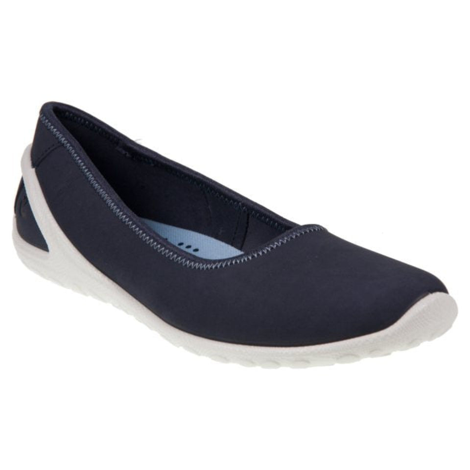 A single women's slip-on flat shoe in navy blue suede with a contrasting white sole, shown from a side profile view against a plain white background.