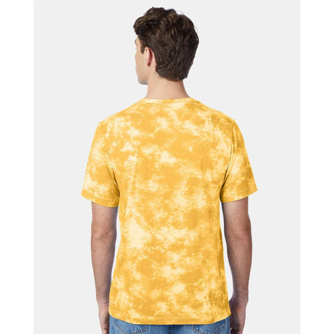 Person wearing a yellow tie-dye t-shirt on a white background