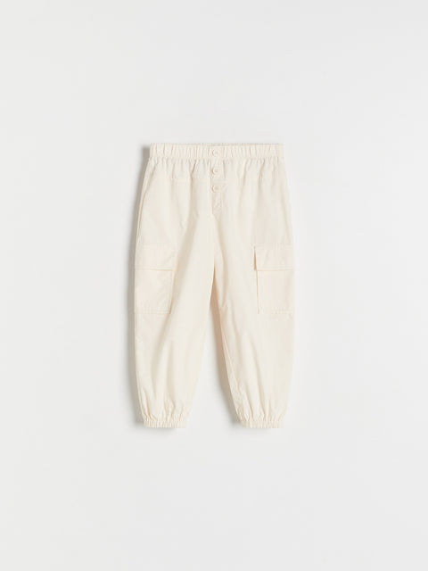 Cream-colored pants on a white background