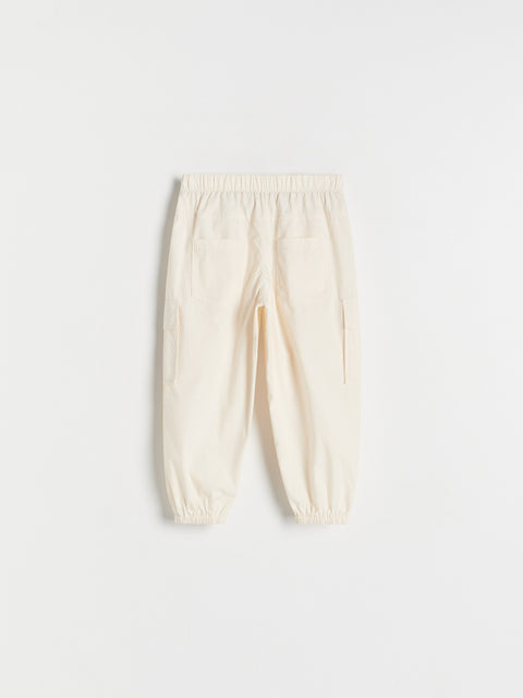 Cream-colored pants on a white background