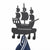A black metal wall hook shaped like a pirate ship, shown against a plain white background with a navy blue and white striped towel hanging from the hooks.