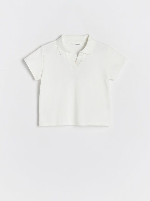 White crop top on a light gray background