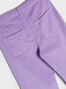 Close-up of purple pants with a plain background