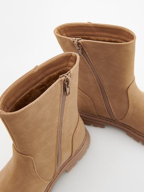 Tan ankle boots with zippers on a white background