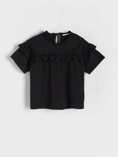 Black blouse with ruffled details on a white background