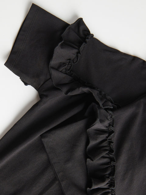 Black ruffled fabric on a white background