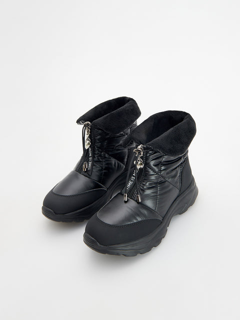 Pair of black winter boots on a white background