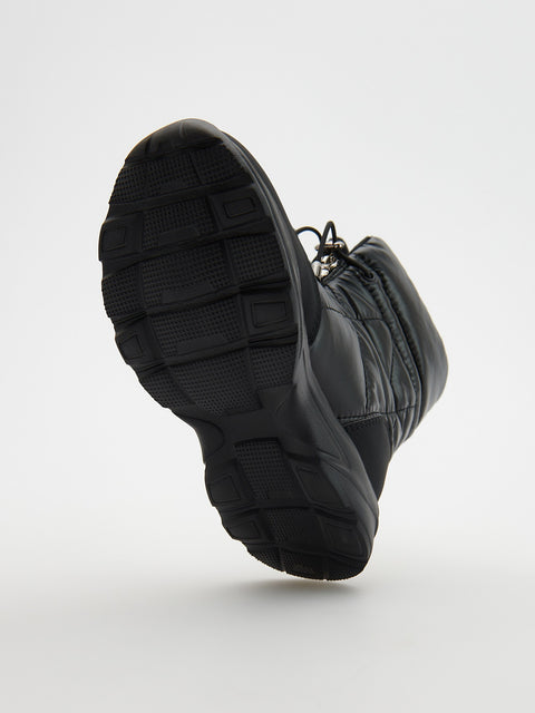 Black boot on a white background