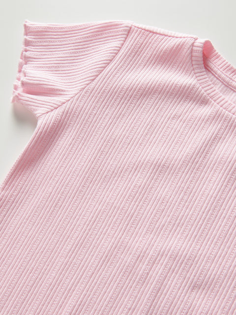 Close-up of a pink ribbed sweater on a light gray background