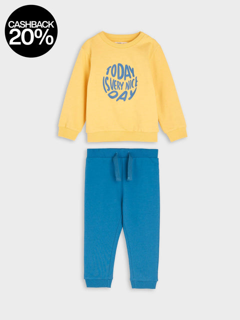 Yellow sweatshirt with blue text and blue pants on a white background