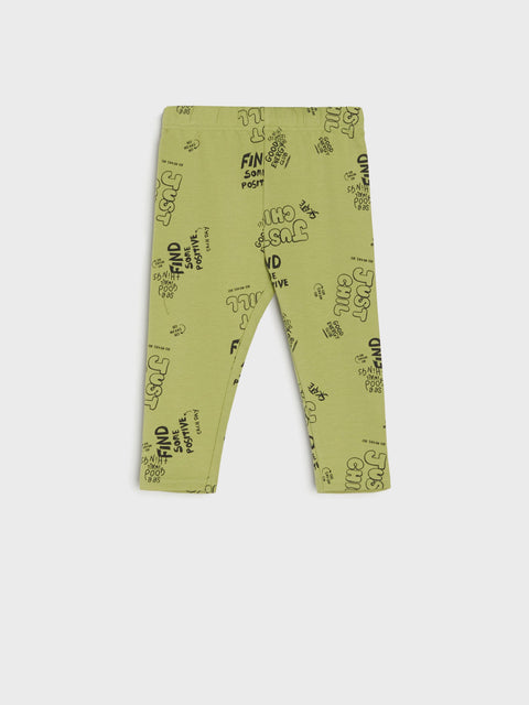 Green leggings with text pattern on a white background
