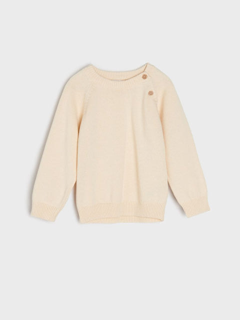 Beige sweater on a light gray background