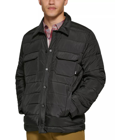 Man wearing a black quilted jacket on a white background