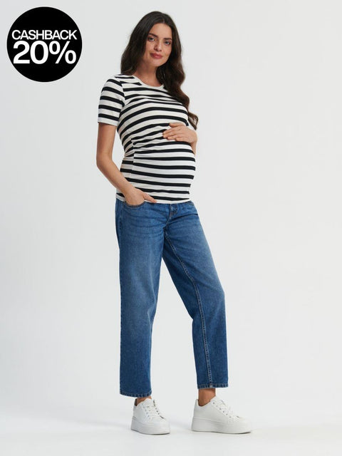 Woman wearing a black and white striped shirt and blue jeans on a white background