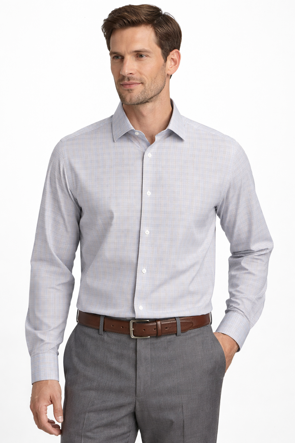 Man wearing a light gray dress shirt and gray pants on a white background