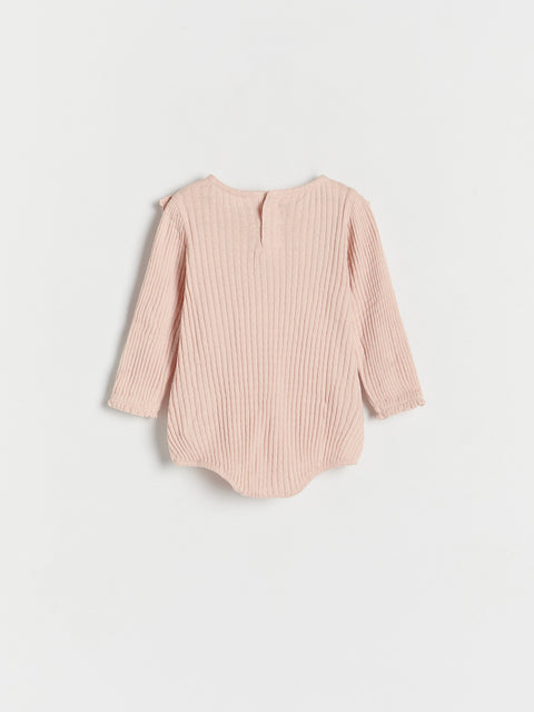 Pink ribbed long-sleeve baby bodysuit on a light gray background