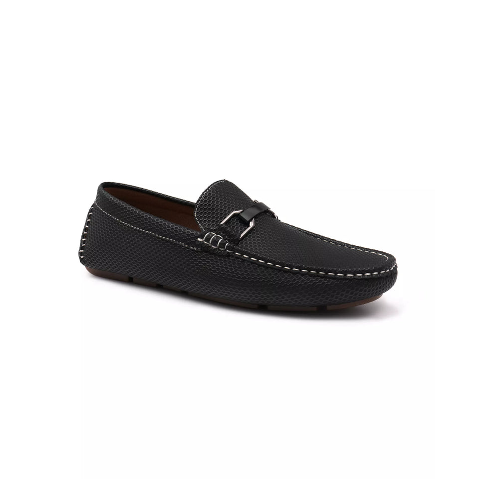 Black loafer shoe with gold buckle on a white background