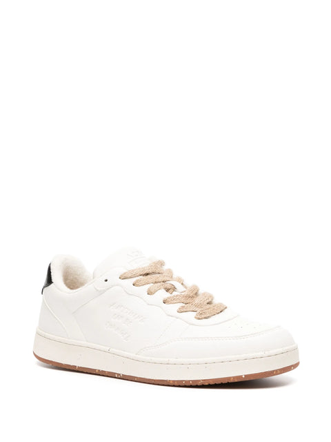 White sneaker with beige laces on a white background