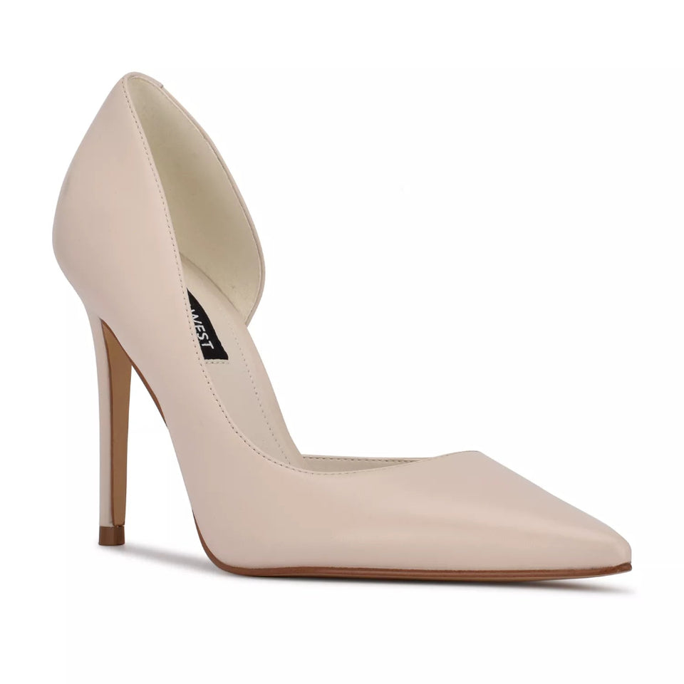 A single light beige pointed-toe pump with a slim high heel, shown from a side profile on a clean white background. The brand name 'Niki' is visible on the black insole label.