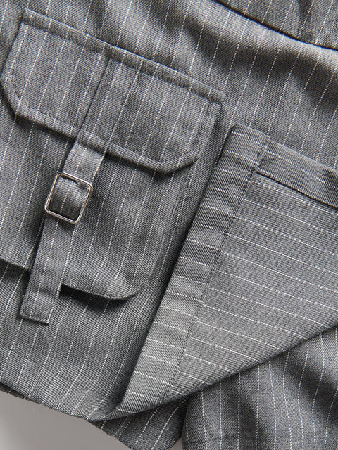 Close-up of a gray pinstripe suit with a pocket detail
