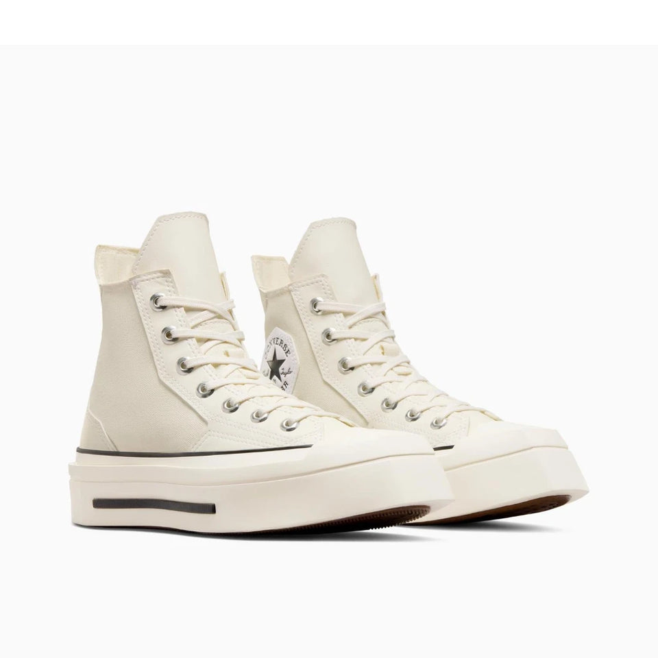 A pair of off-white high-top platform sneakers with chunky soles, shown from a three-quarters angle on a light gray background.