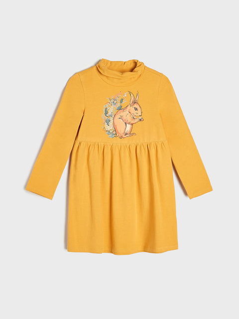 Yellow dress with a squirrel design on a white background