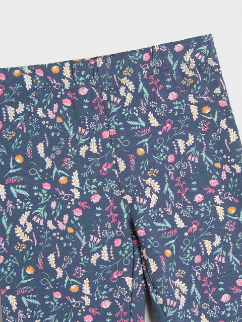 Floral patterned fabric with colorful flowers on a blue background