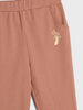 Brown sweatpants with floral embroidery on a white background