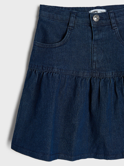 Blue denim skirt on a white background