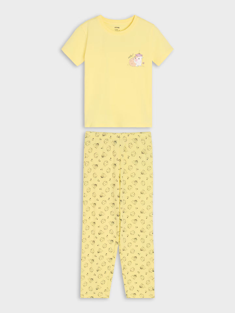 A two-piece children's pajama set consisting of a short-sleeve yellow t-shirt with a small unicorn graphic on the left chest and matching yellow patterned pants, displayed flat against a light gray background.